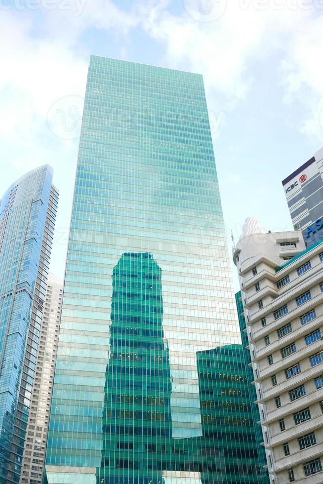 low angle view of singapore city buildings. photo