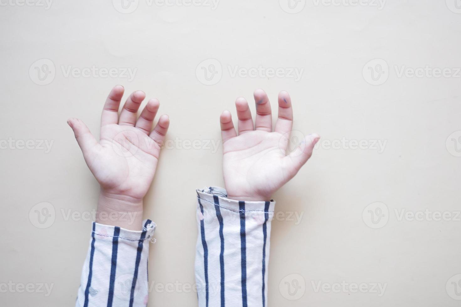 top view of baby hand on black background. photo