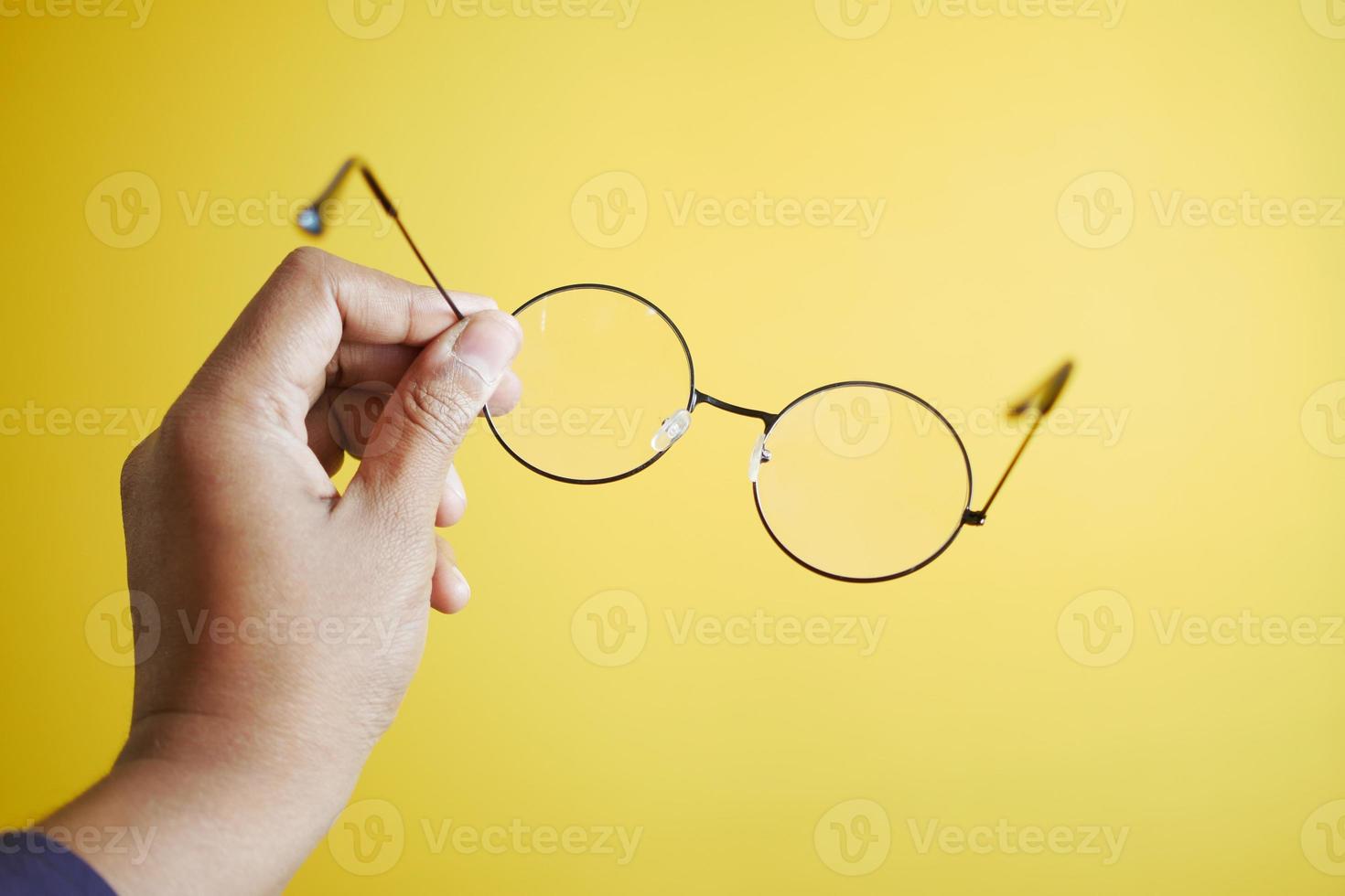 men holding a Old eyeglass photo