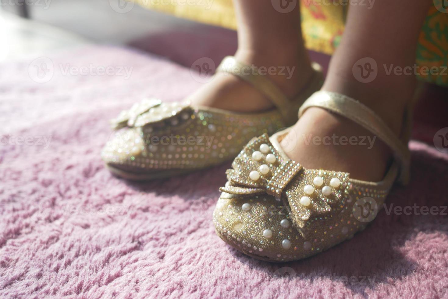 child girl feet wearing sandal at early morning photo