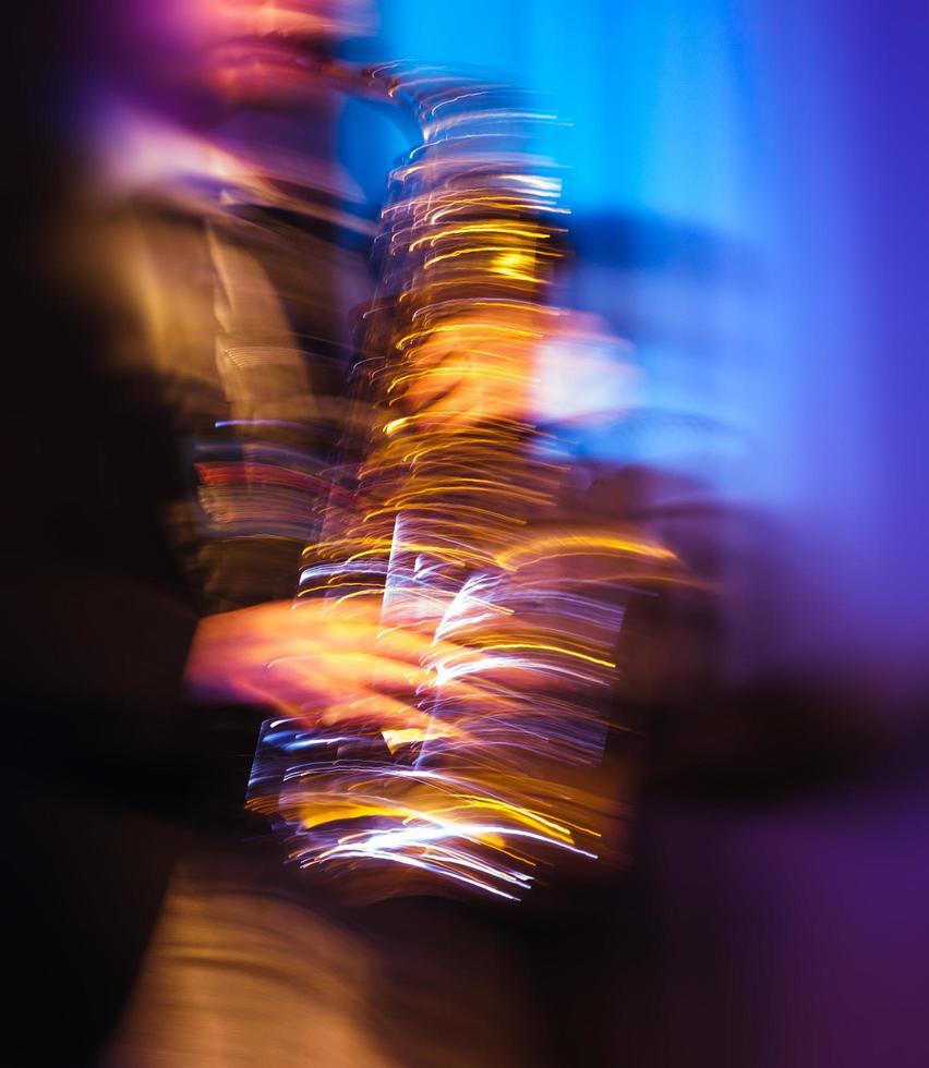 Saxophone player performing on stage photo
