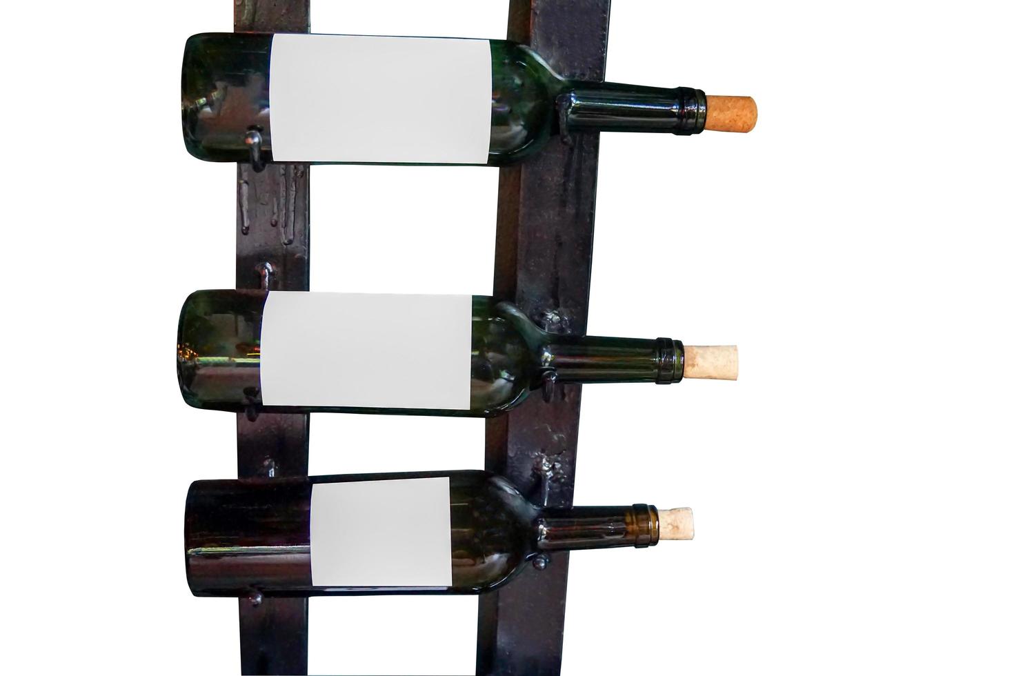 isolated Bottles of wine lined up on the shelf. The background is white. Soft and selective focus. photo