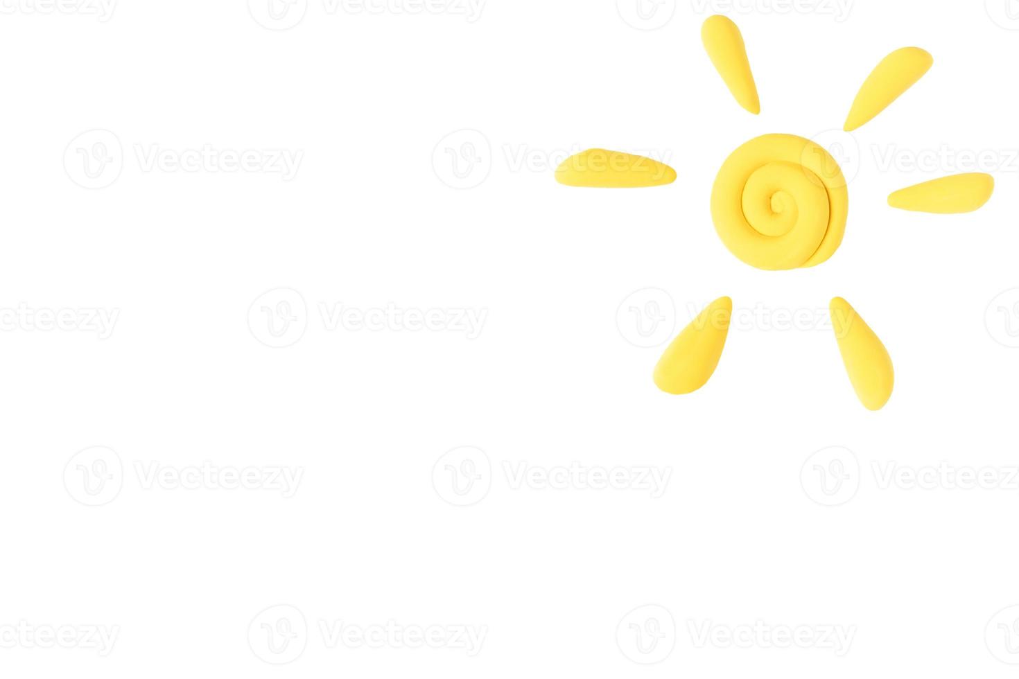 Plasticine sun, white isolated background. Kids play background. Copy space. photo