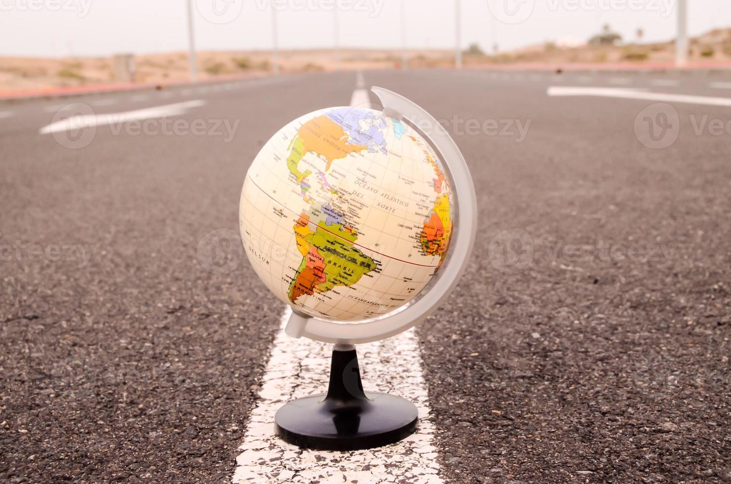 Globe on the road photo