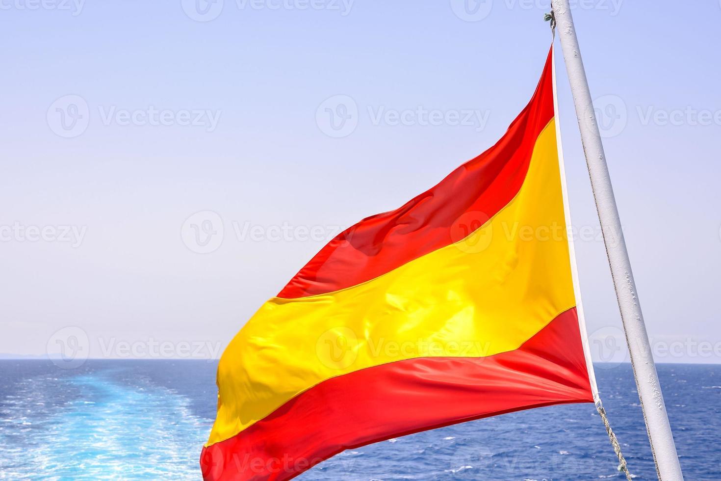 Spanish flag by the sea photo