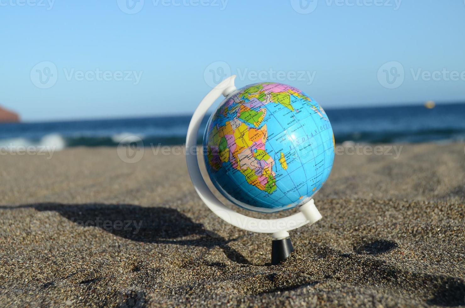 Globe on the beach photo