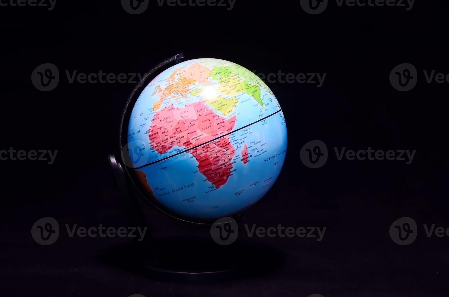 Globe on black background photo