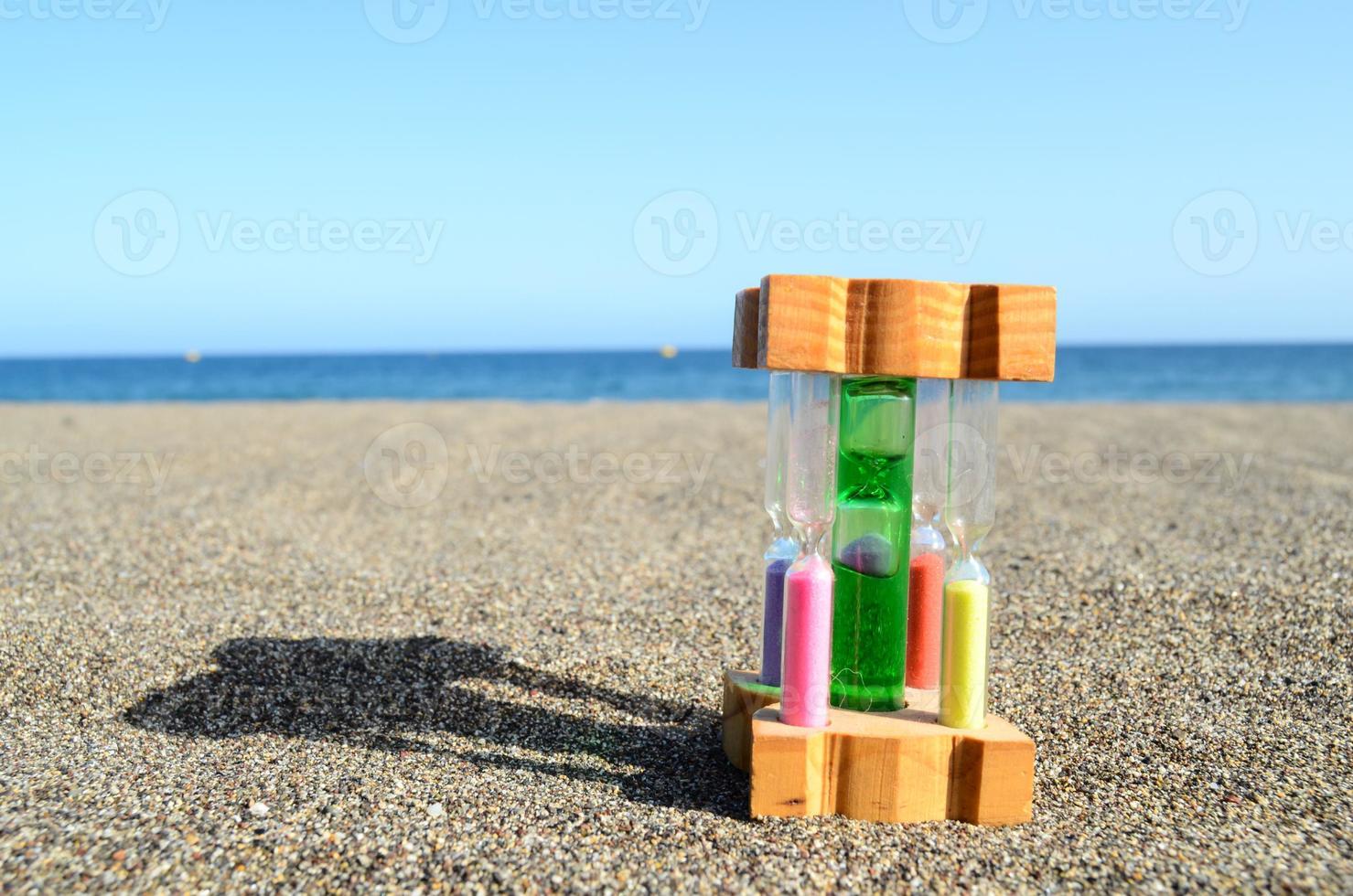Hourglass on the ground photo