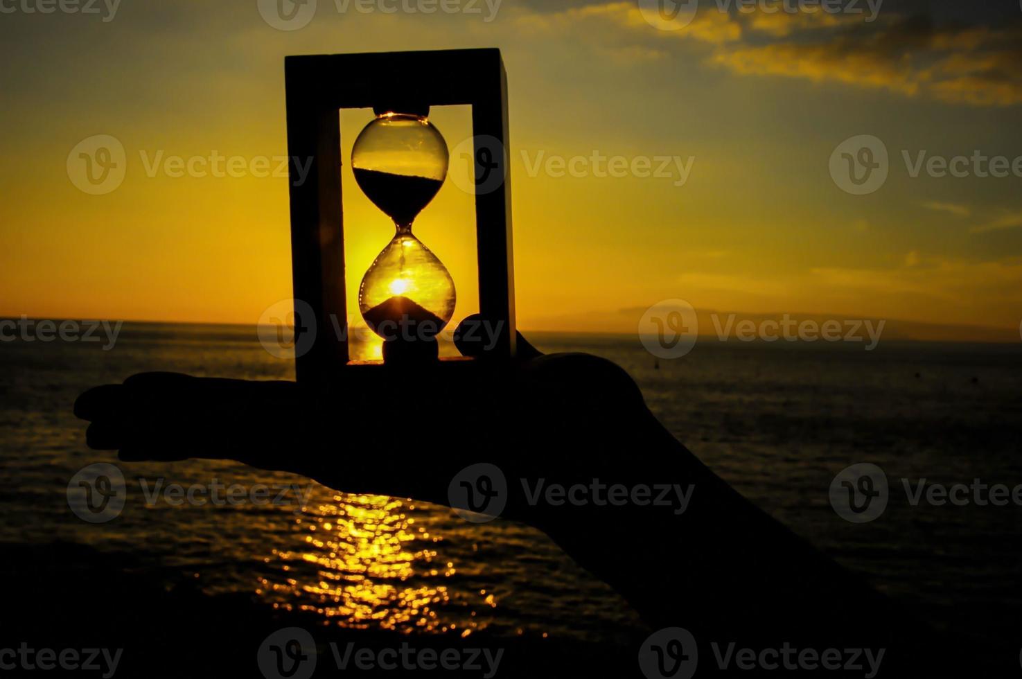 Hourglass over the sunset photo