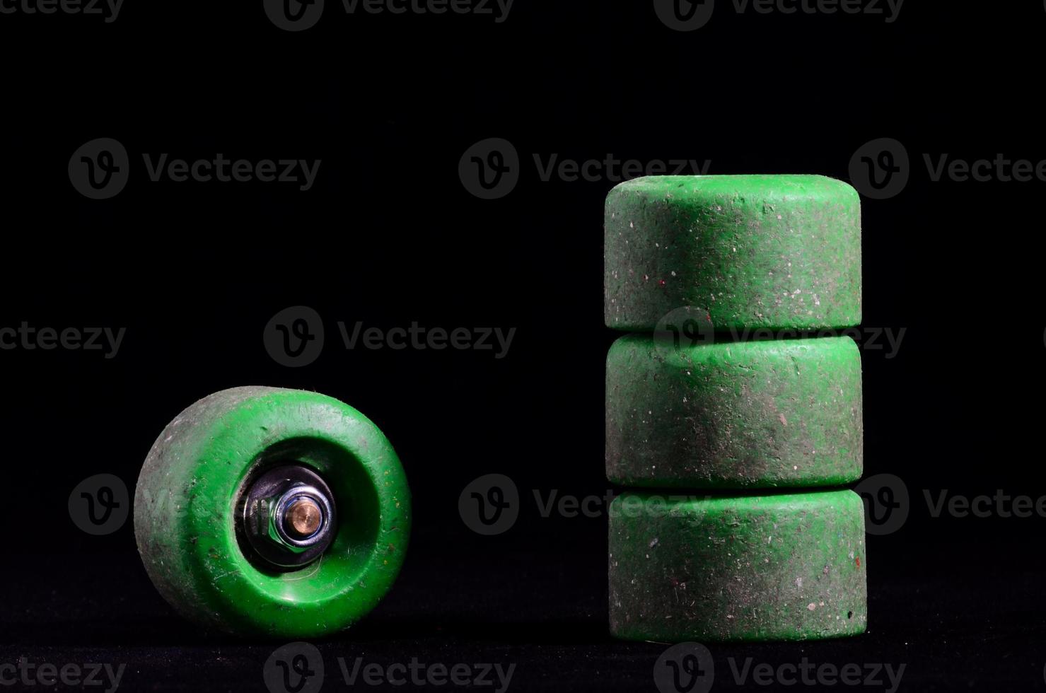 Skateboard wheels on black background photo