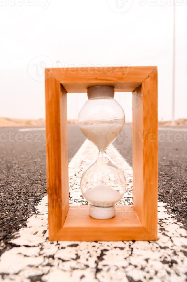Hourglass on the road photo