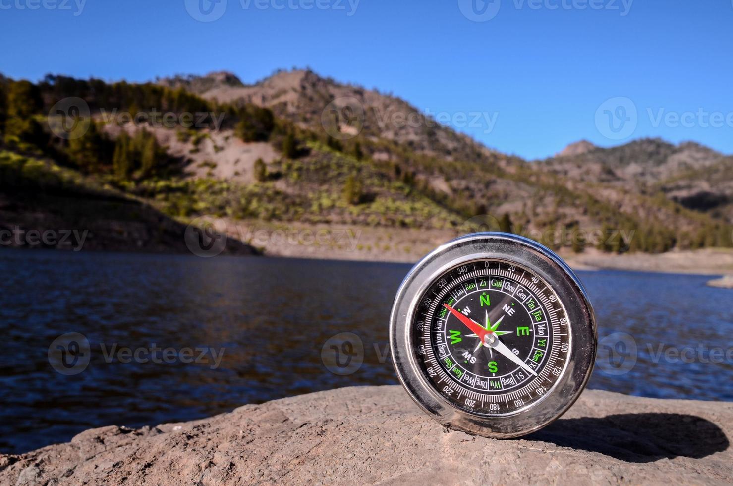 Compass on a rock photo