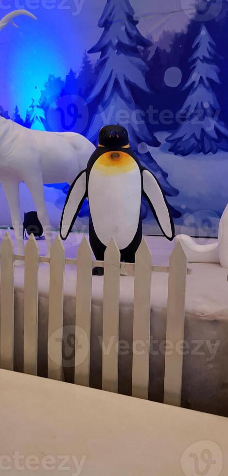 a single penguin in winter festival photo