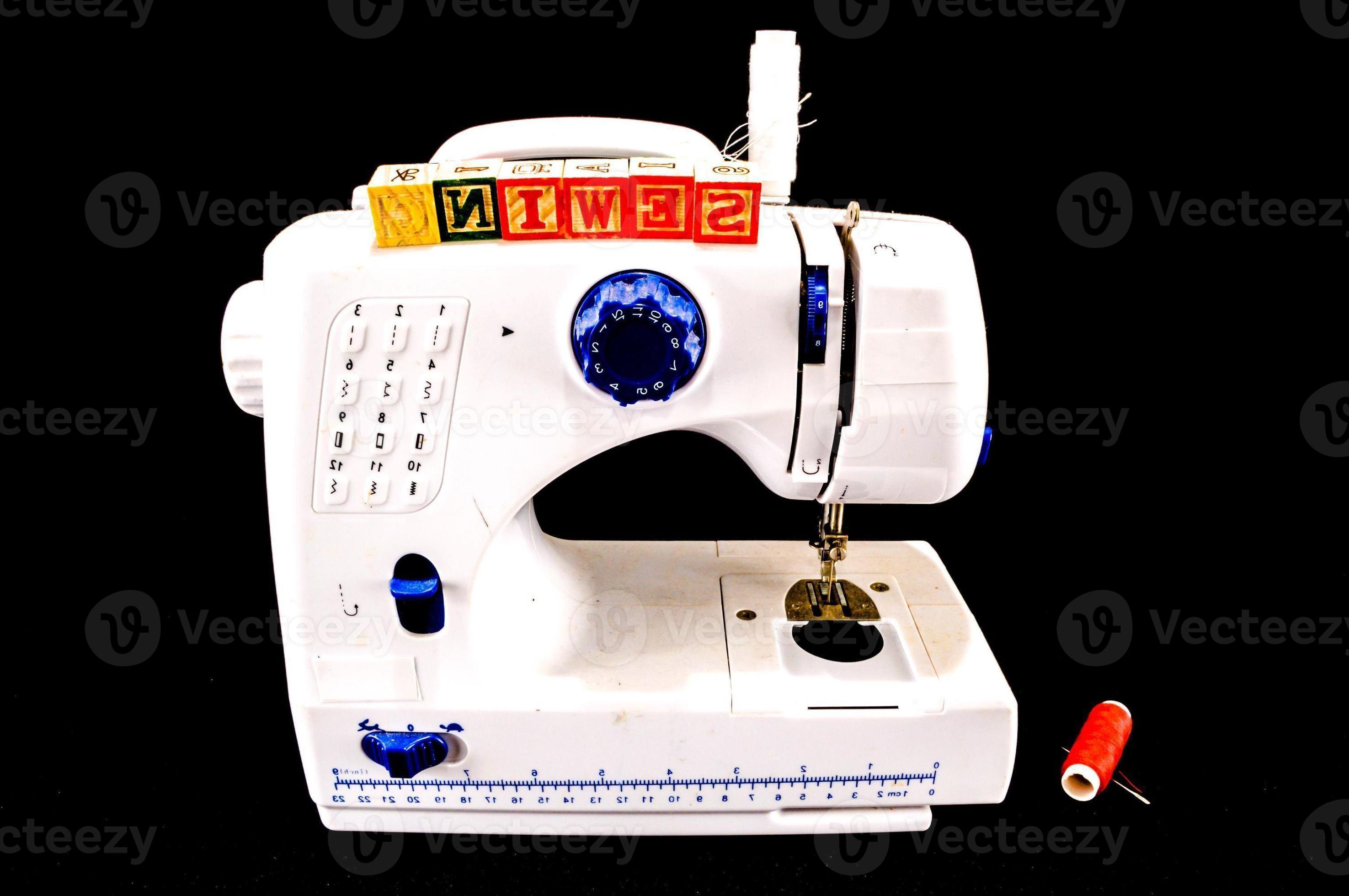 Sewing machine on black background 17652143 Stock Photo at Vecteezy