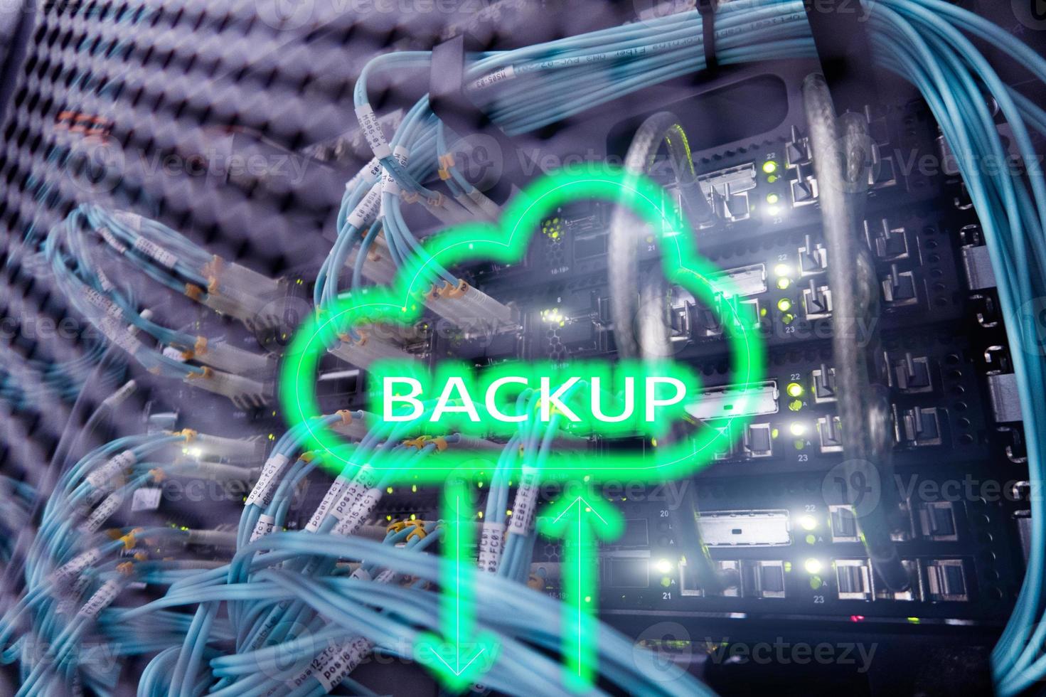 Backup button on modern server room background. Data loss prevention. System recovery. photo