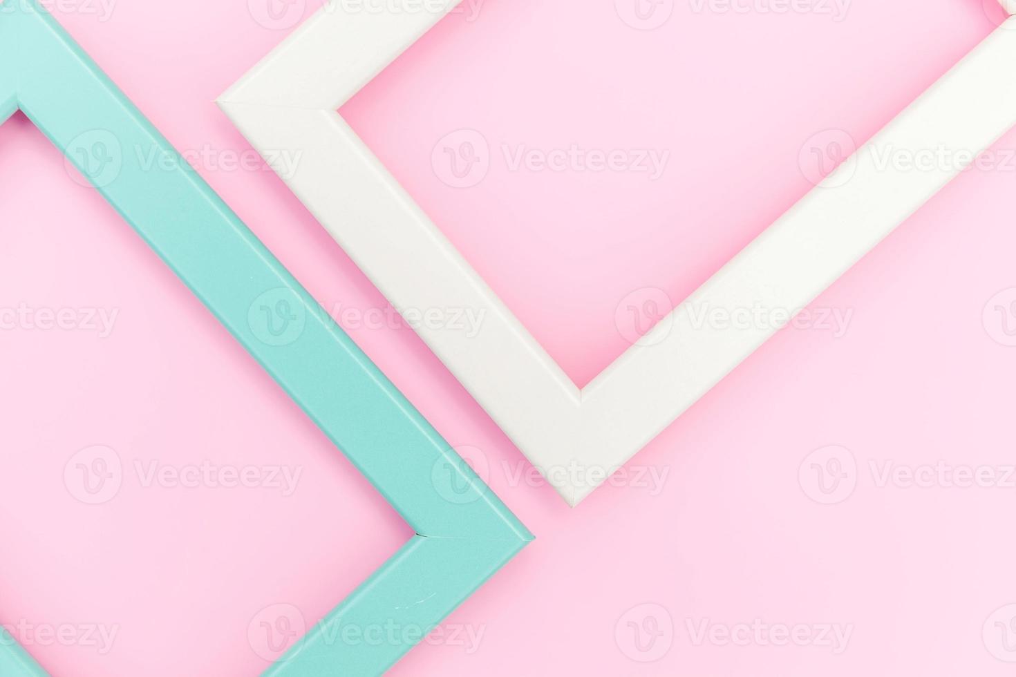 Simply design with empty pink and blue frame isolated on pink pastel colorful background. Top view, flat lay, copy space, mock up. Minimal concept. photo