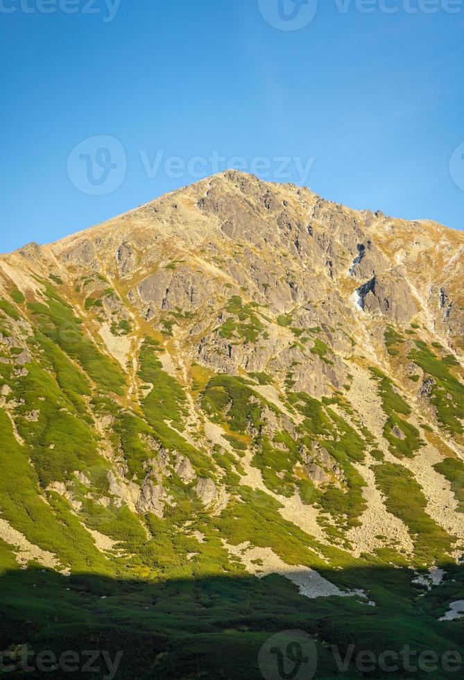 High Tatra mountain autumn sunny day, relaxing landscape, alp view. Natural view during summer trekking in highlands with peaks and rocky hills view. National Park in Poland. photo