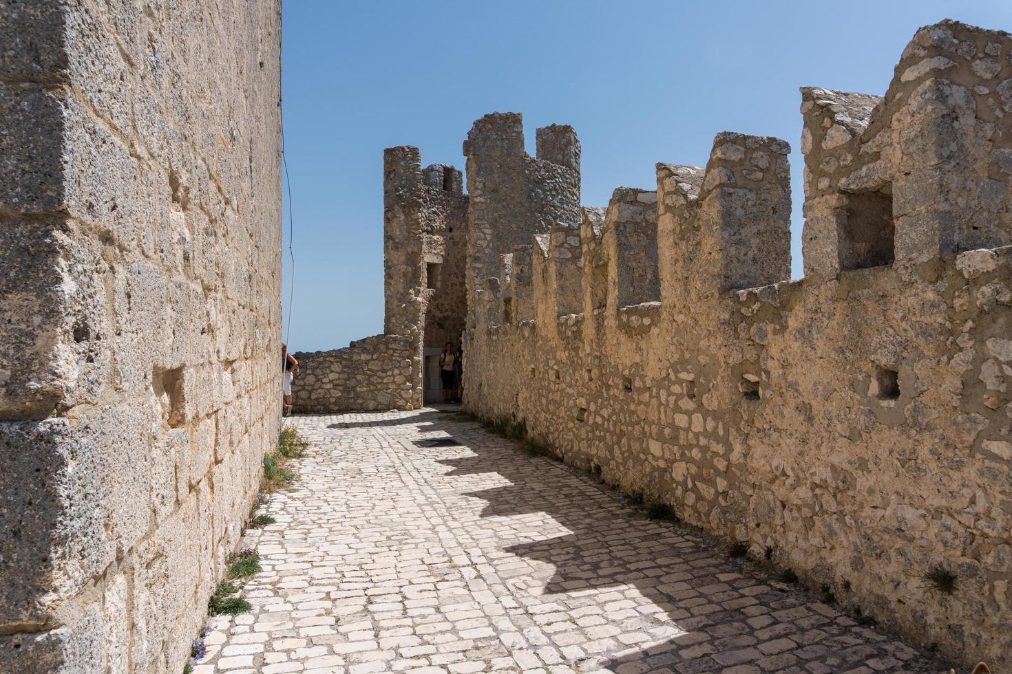 Calascio, Italy-august 9, 2021-particular of the ruins of Rocca Calascio during a sunny day photo