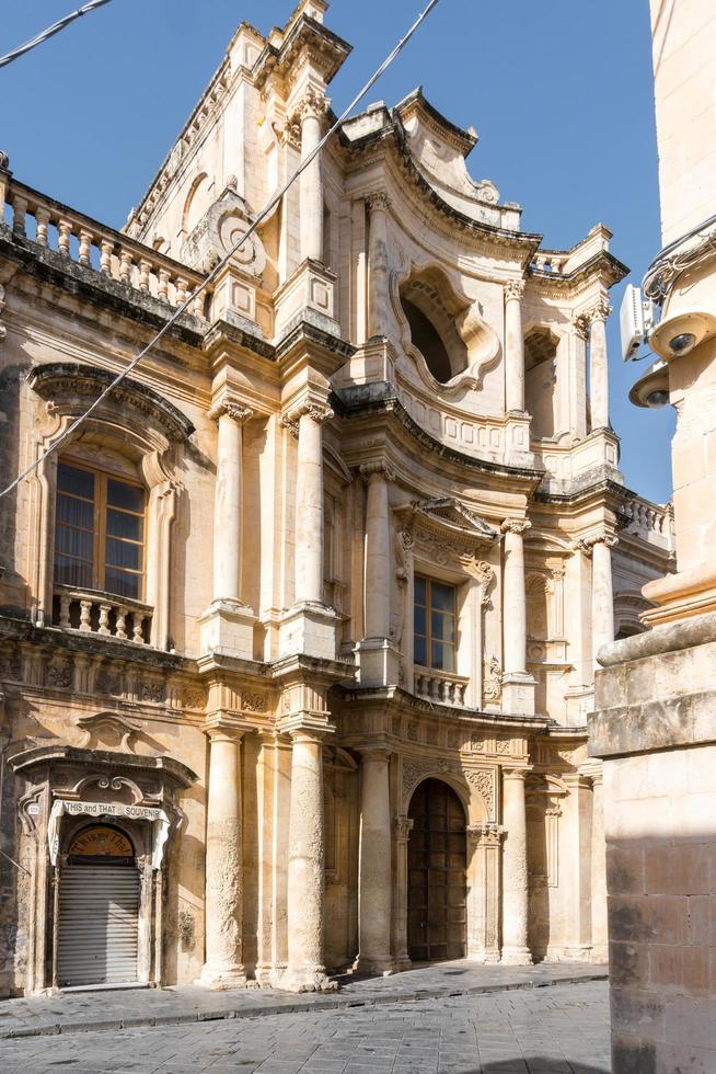 Noto,Italy-May 8, 2022-View of the Ducezio palace from from the top of the stairway of the Cathedral during a sunny day photo