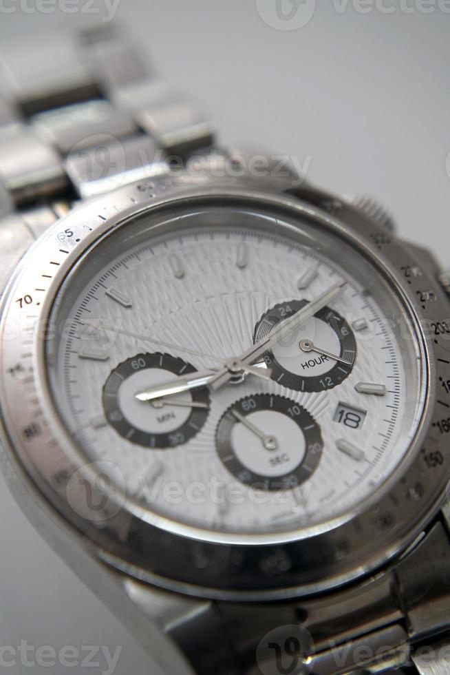 Elegant silver and white wrist watch with metal details photo