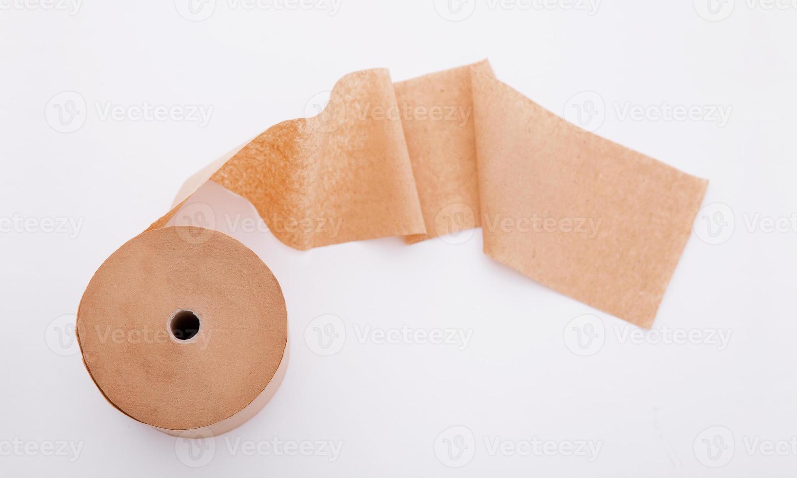 Paper roll mock up isolated on white background. Blank white packaging kitchen towel, toilet paper roll, cash register tape, thermal fax roll. Paper roll template. Top view. photo