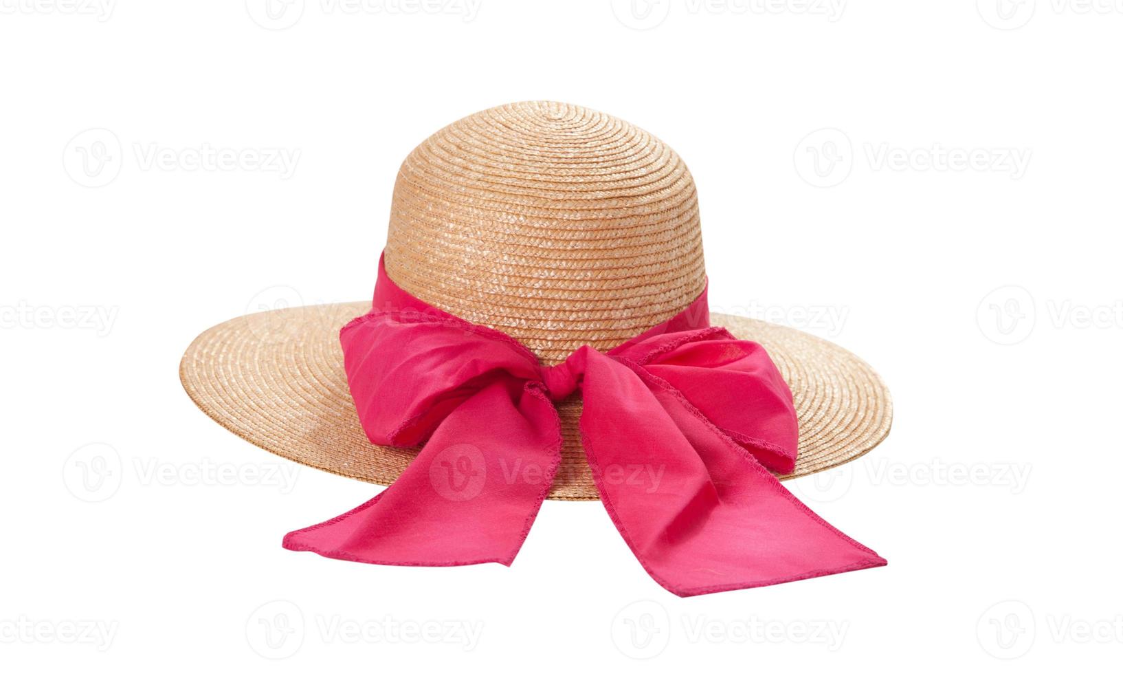 Pretty straw hat with ribbon and bow on white background. Beach hat top view isolated photo