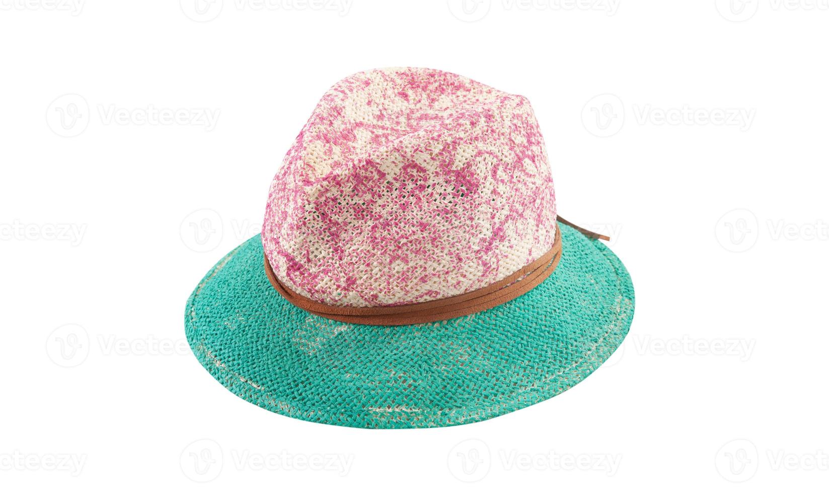 Pretty straw hat with ribbon and bow on white background. Beach hat top view isolated photo