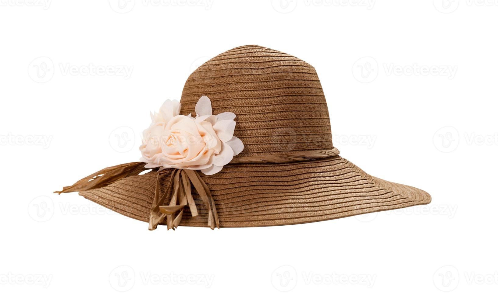 Pretty straw hat with ribbon and bow on white background. Beach hat top view isolated photo