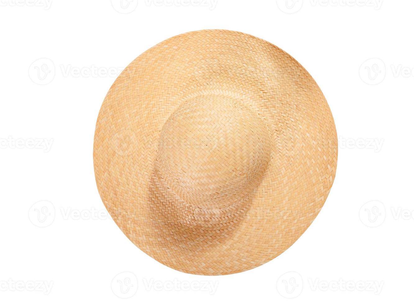 Pretty straw hat with ribbon and bow on white background. Beach hat top view isolated photo