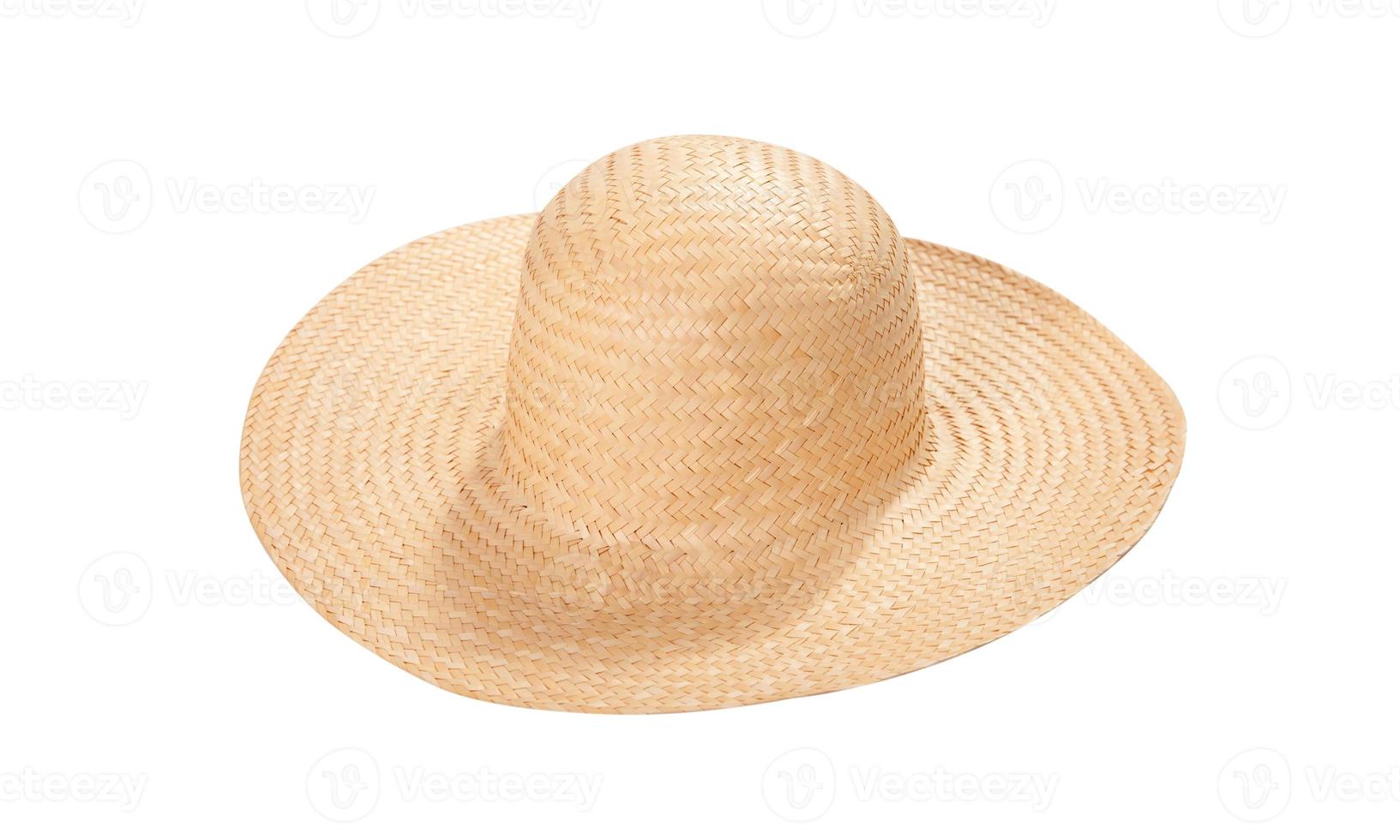 Pretty straw hat with ribbon and bow on white background. Beach hat top view isolated photo