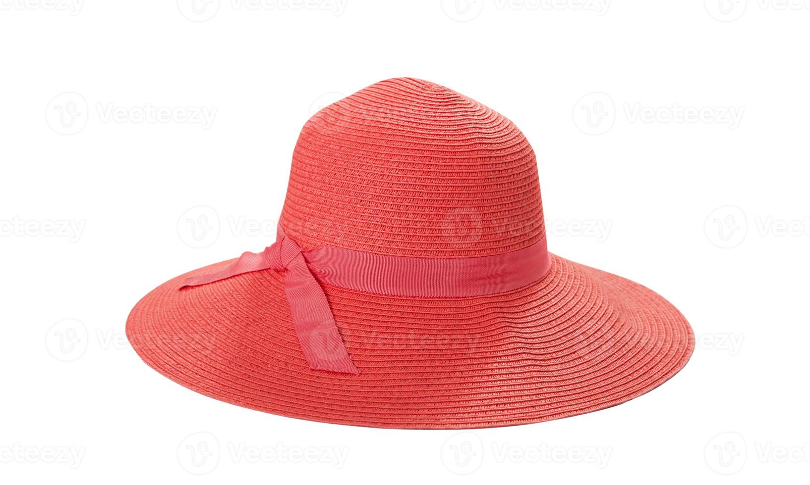 Pretty straw hat with ribbon and bow on white background. Beach hat top view isolated photo