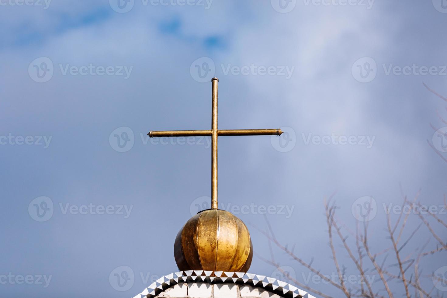 Orthodox church cross on a background of blue sky with clouds. Easter. Christmas. Place for text. Background image. Religion. selective focus photo