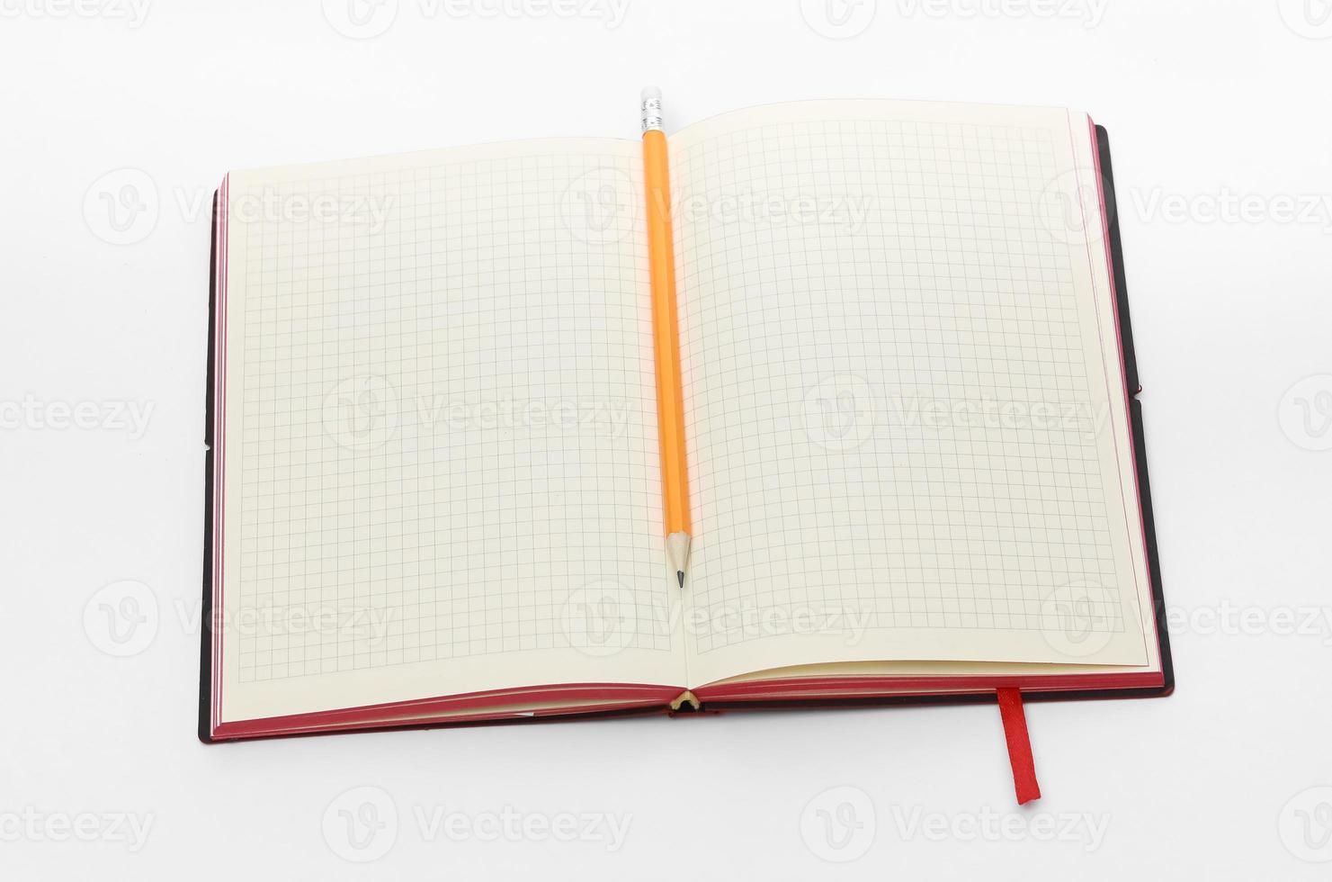 Business concept. Top view collection of notebook, white open flip curl rolled page and pencil on background for mockup photo