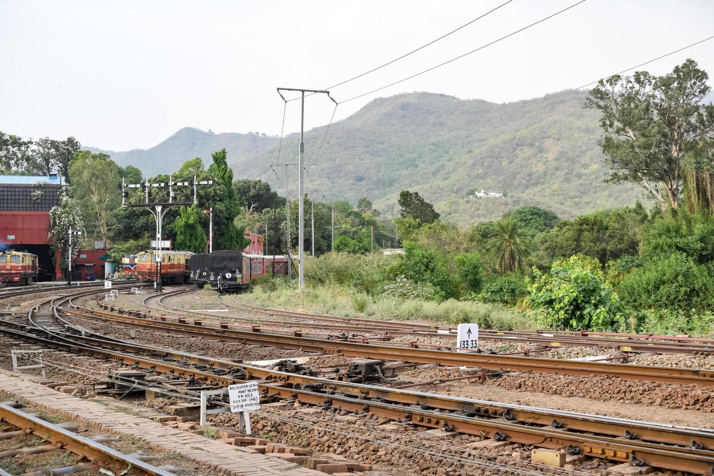 Kalka, Haryana, India May 14 2022 - View of Toy train Railway Tracks from the middle during daytime near Kalka railway station in India, Toy train track view, Indian Railway junction, Heavy industry photo