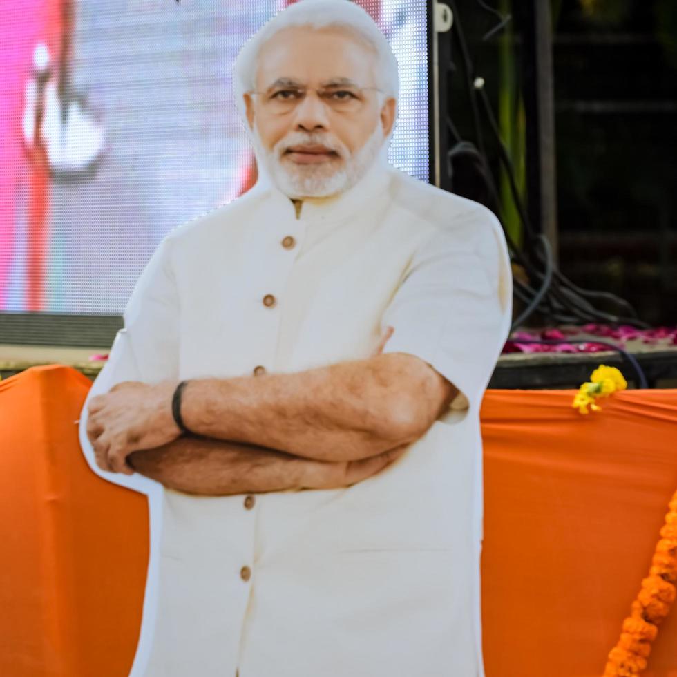 New Delhi, India - January 16 2023 - Prime Minister Narendra Modi cut out during BJP road show, the status of PM Modi while attending a big rally in the capital photo
