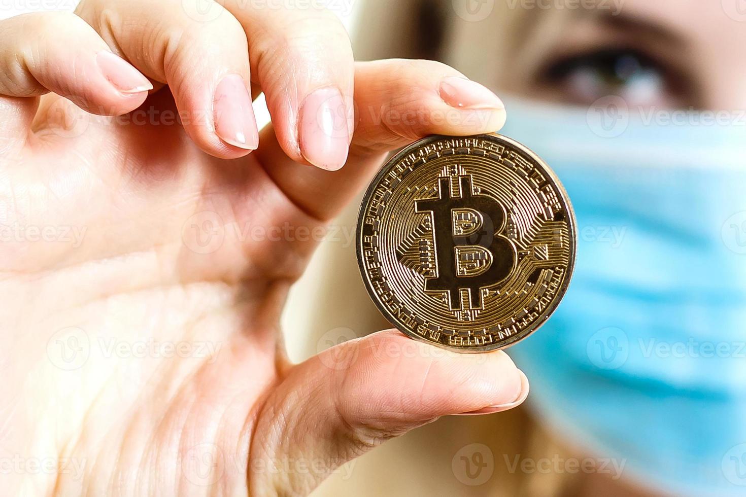 Closeup portrait of a young doctor wearing a mask isolated on white background bitcoin photo