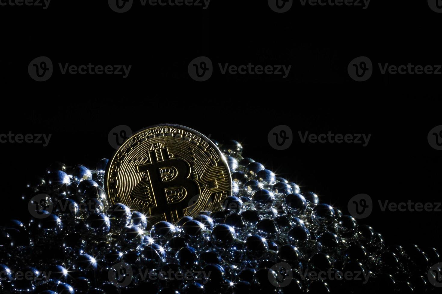 Golden bitcoin on black background with copy space cryptocurrency mining concept  silver photo