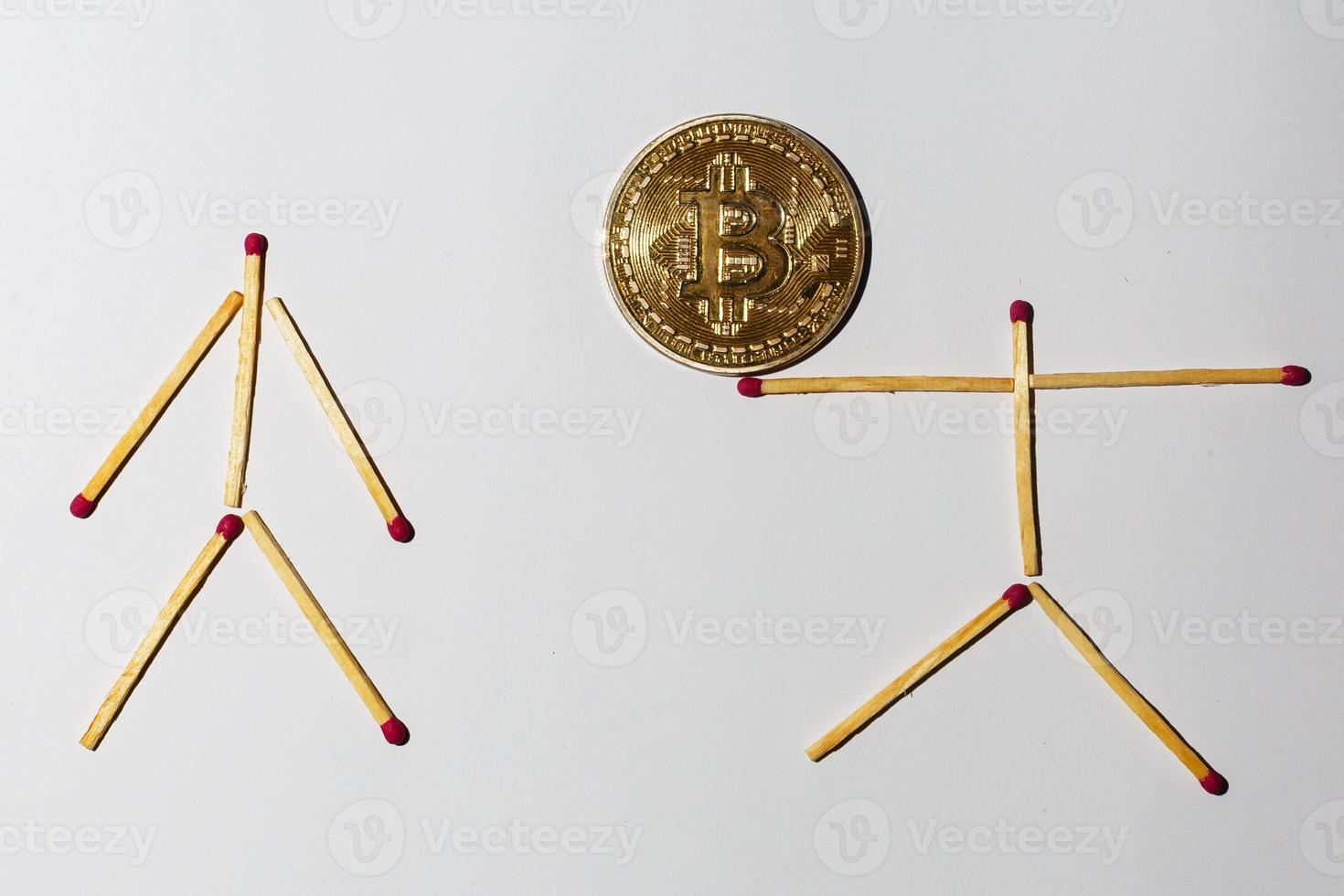 Golden bitcoin on isolate white background concept mining  little man photo