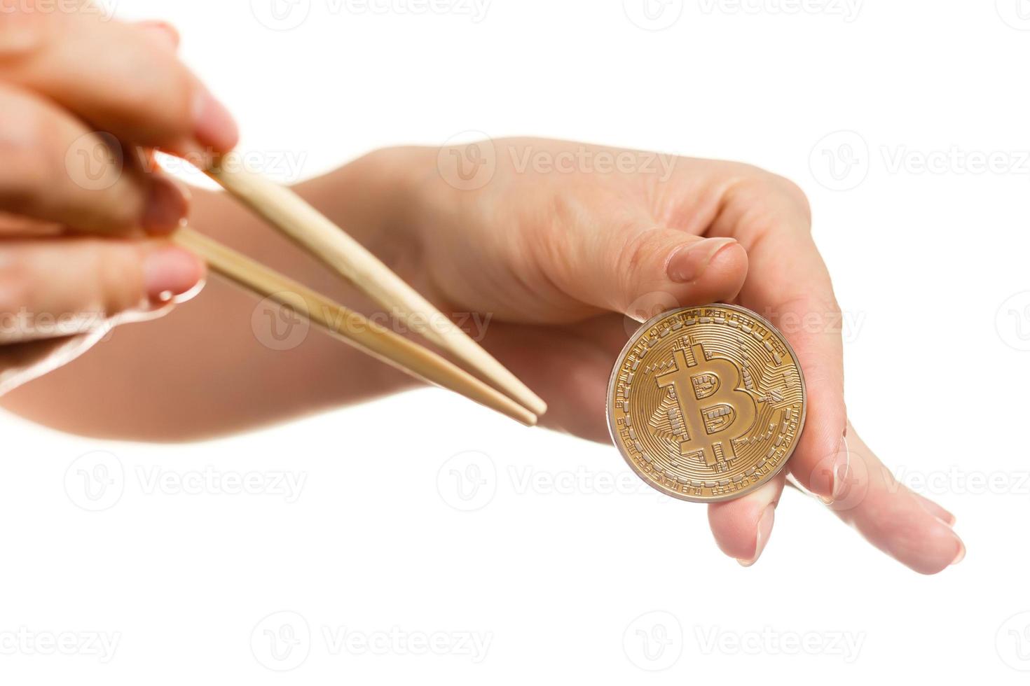 Isolated of hand putting a bitcoin concept human hand with bitcoin hand with bitcoin photo