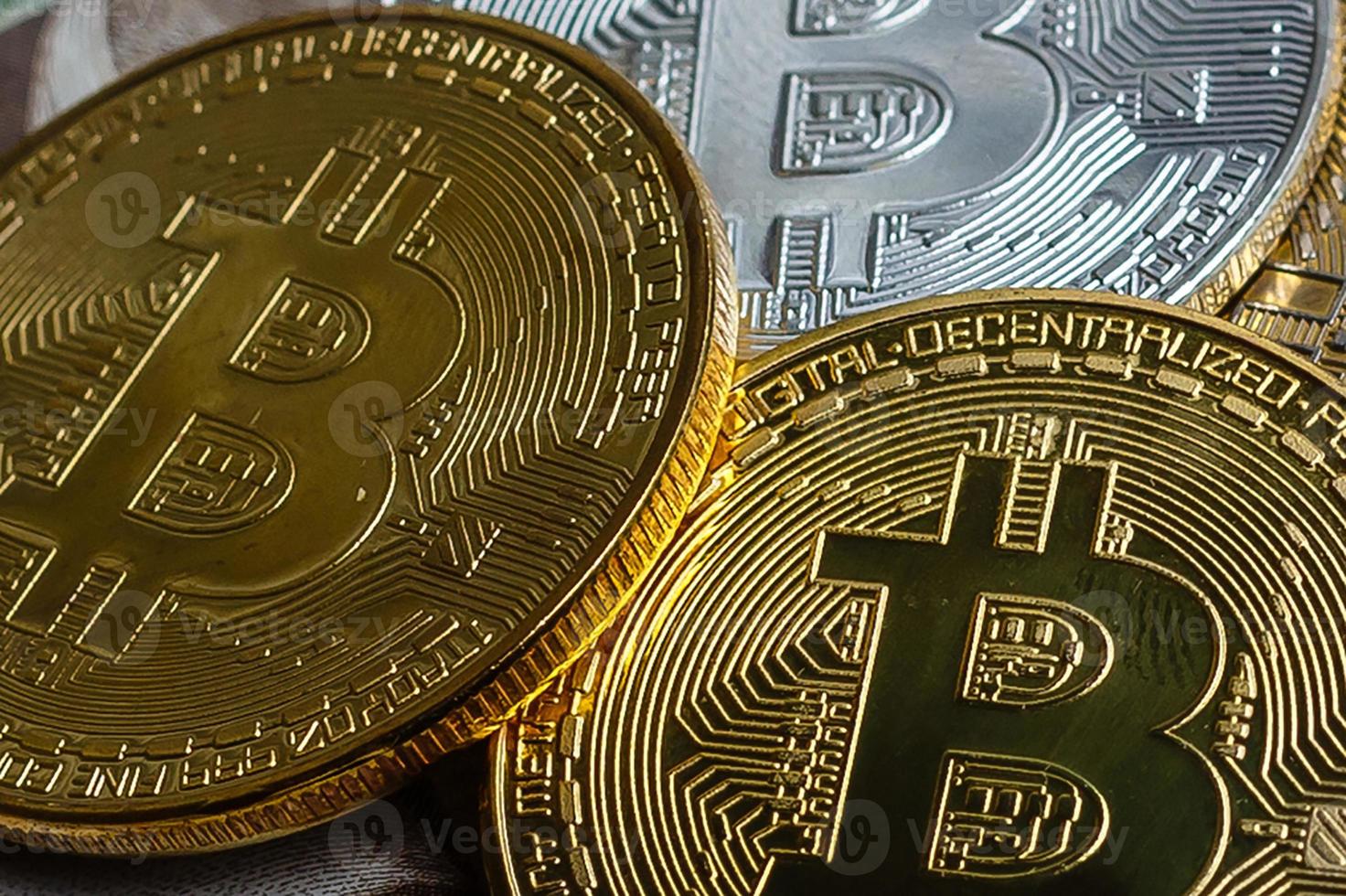 Bitcoin and ukraine national currency hryvnya on background photo
