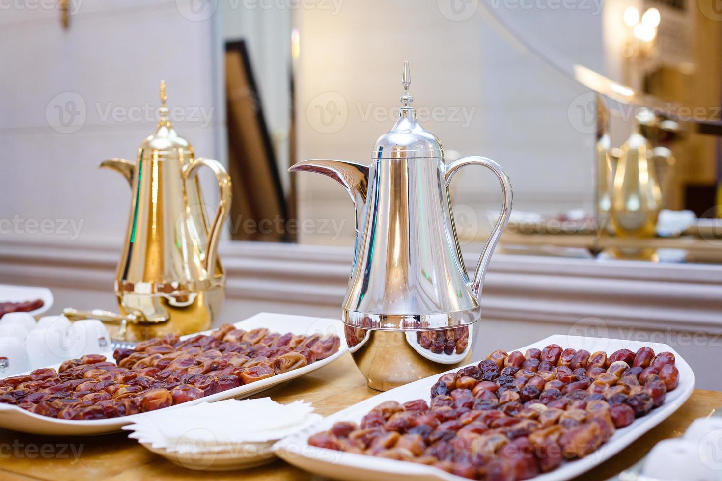 Dates on a tray and decanters photo