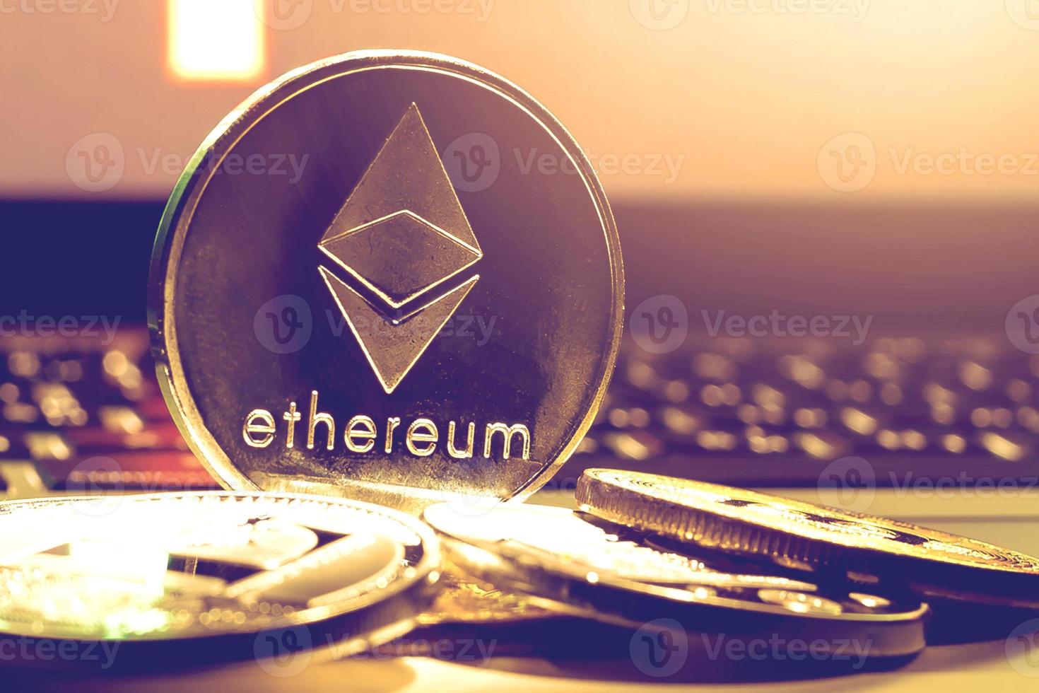 ethereum on gold background to illustrate blockchain and cyber currency photo