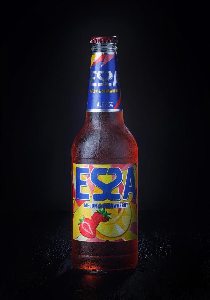 KRASNOYARSK, RUSSIA - OCTOBER 21, 2022 Misted bottle of ESSA beer on a black background. Fruit beer. photo