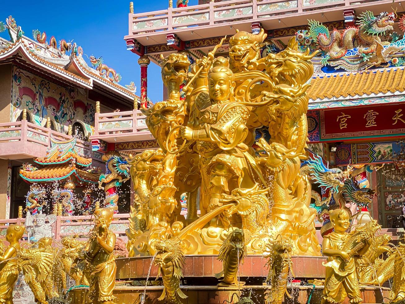 Ang Silla,Chonburi,Thailand-January 14,2023, Naja statue golden is a beautiful Thai and Chinese architecture of Nachas sa thai chute shrine, naja shrine, najasaataichue, nezha shrine chinese temple. photo