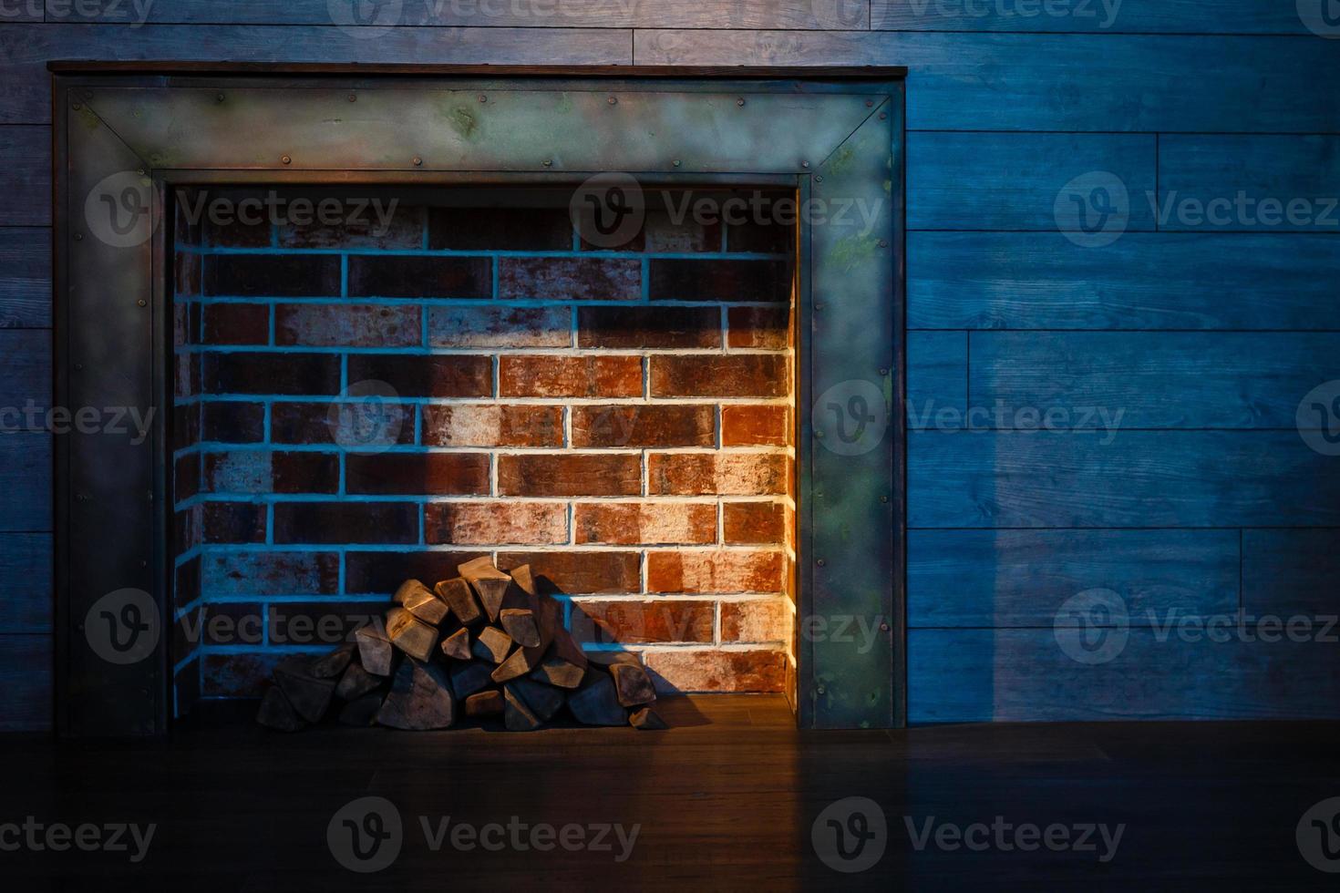 Tradional wood burning stove in a brick fireplace photo