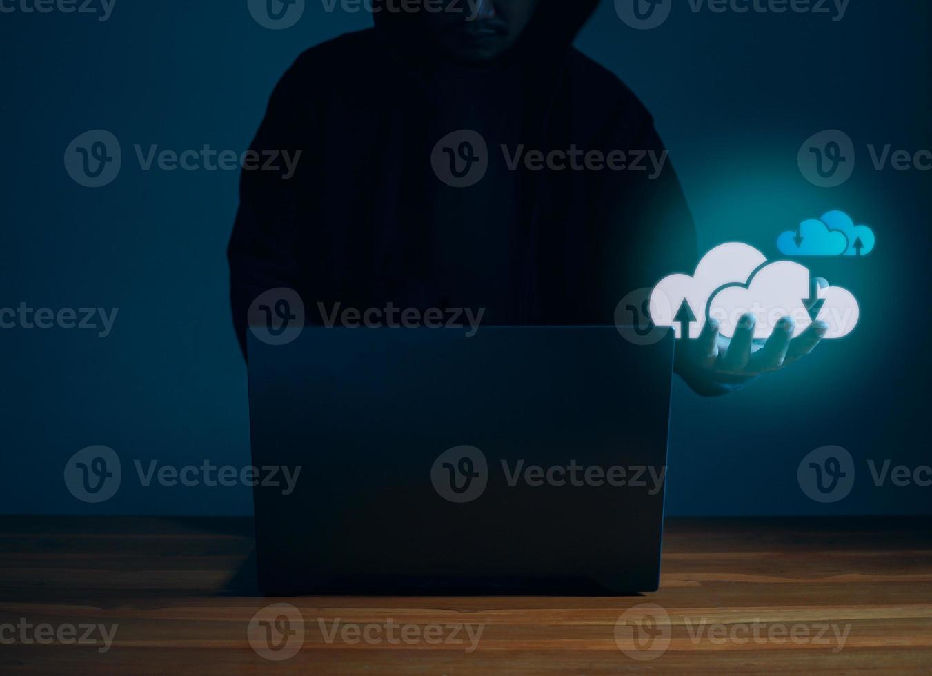 Hackers work on laptops in the dark. Concepts of information security systems in the Internet network and information espionage. Cloud computing. photo