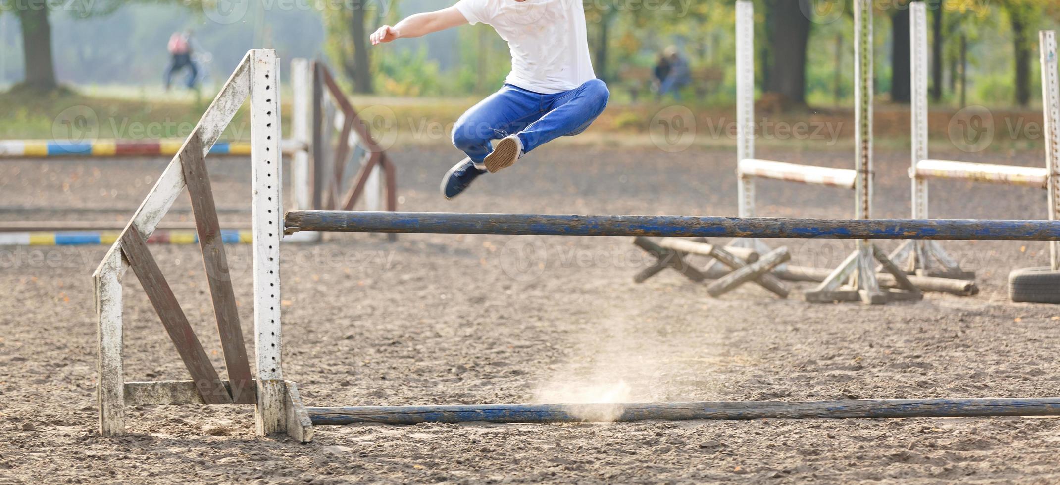 the guy jumps through the barrier photo