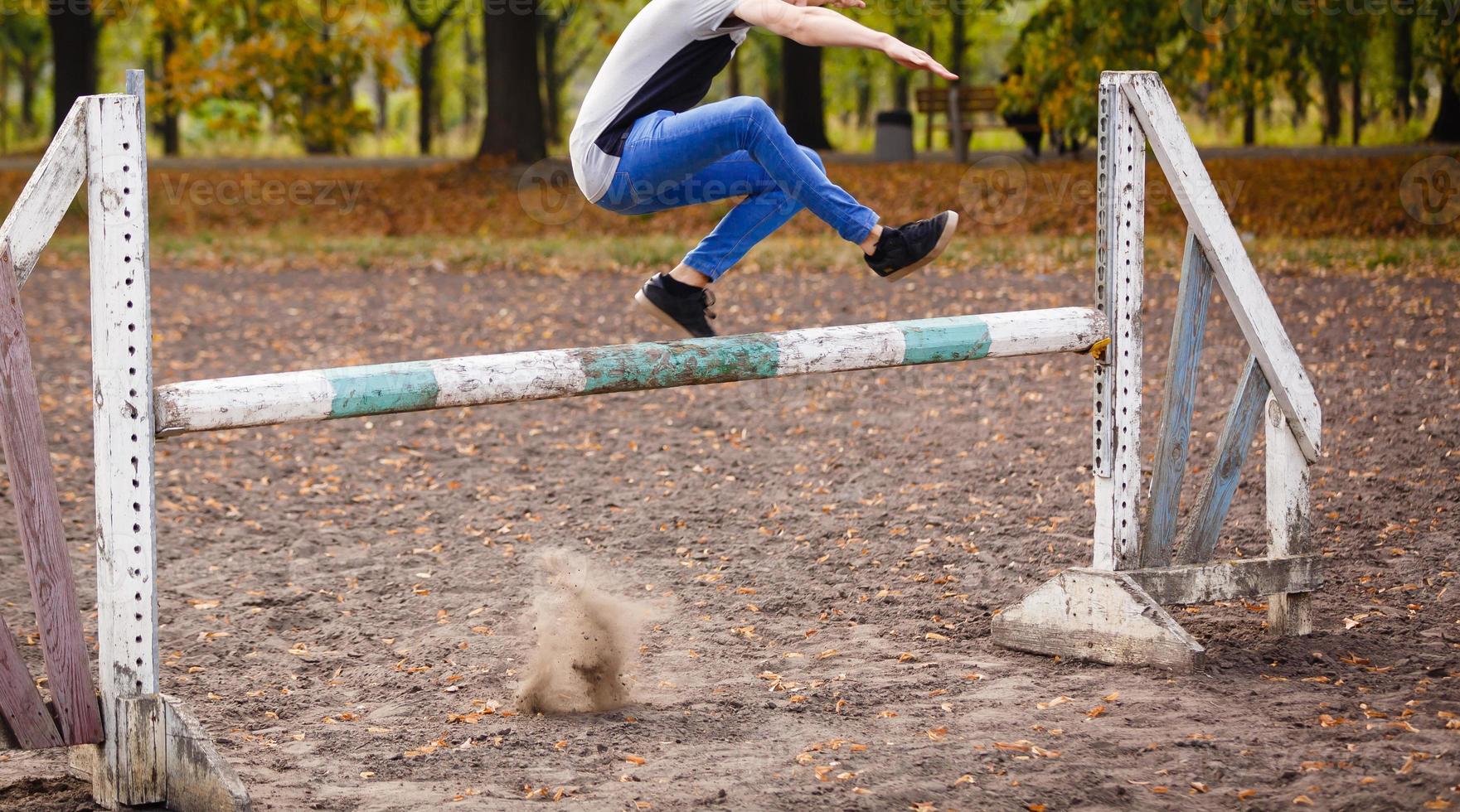 the guy jumps through the barrier photo