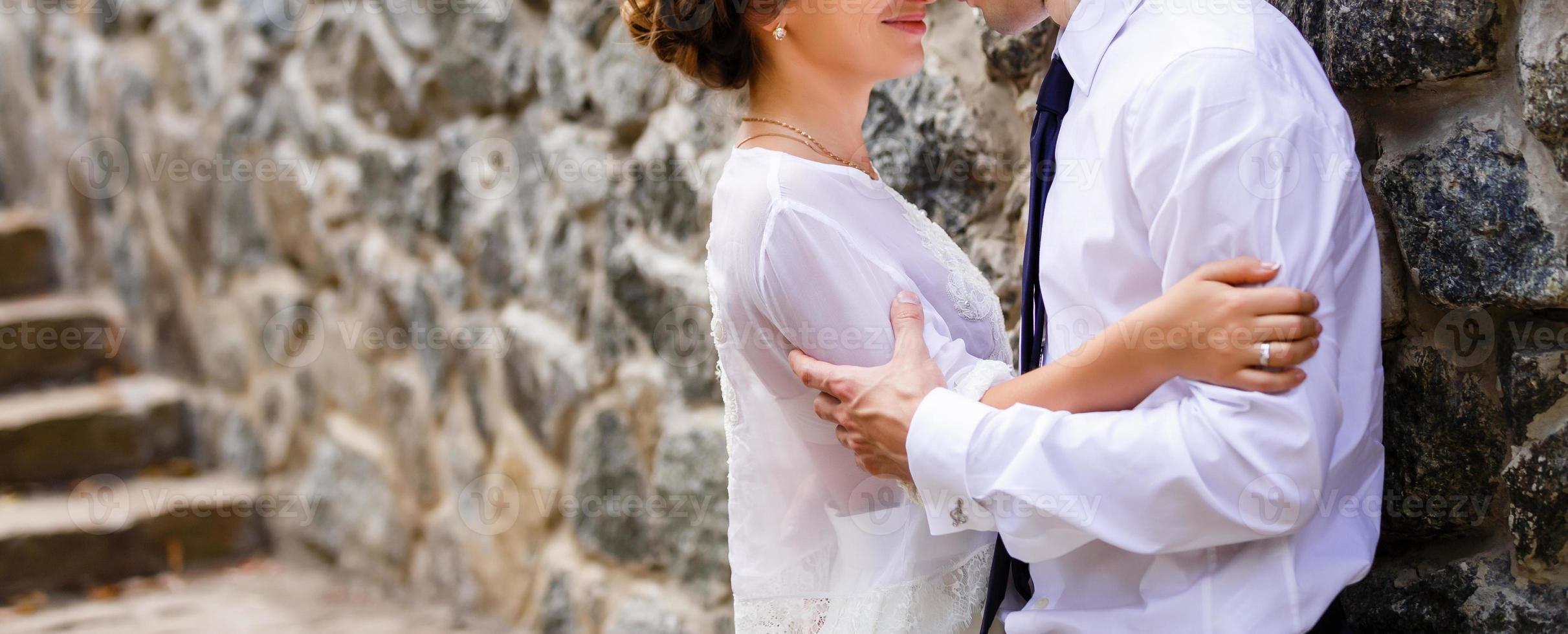 The bride and groom on the background of a mountain stream photo