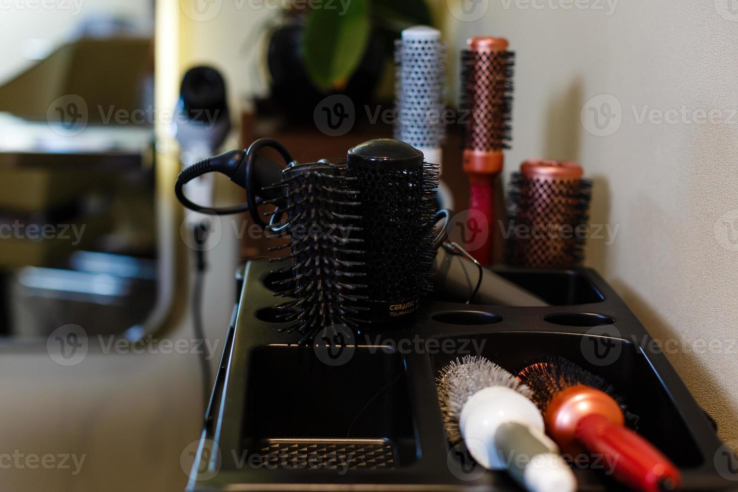 hair tools, beauty and hairdressing concept - different brushes or combs on white background photo